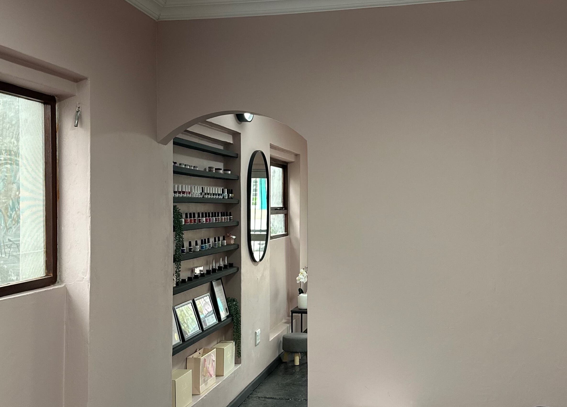 Tranquil wall display at Alae Aesthetics & Cosmetics, Gqeberha, Eastern Cape, ZA featuring shelves and a mirror.