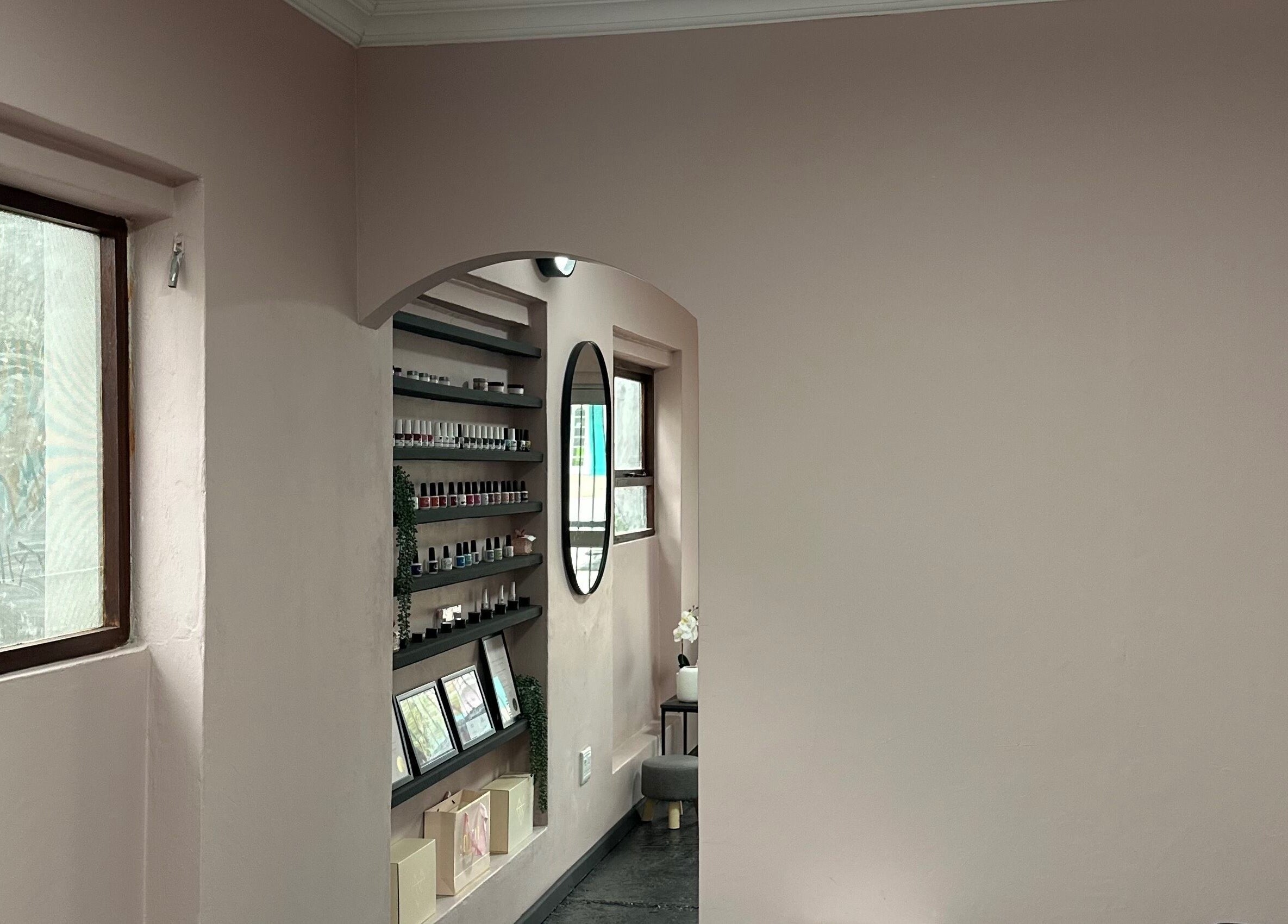 Tranquil wall display at Alae Aesthetics & Cosmetics, Gqeberha, Eastern Cape, ZA featuring shelves and a mirror.
