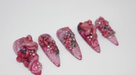 Exquisite pink floral 3D nail art from Aurelia Nails by Miji, Male', MV, showcasing elegant craftsmanship.