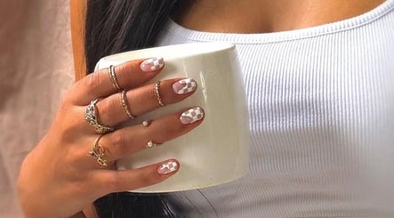 Elegant nail art at Gel By Shanice, Stirling, Western Australia, AU, featuring stylish rings and a white mug.