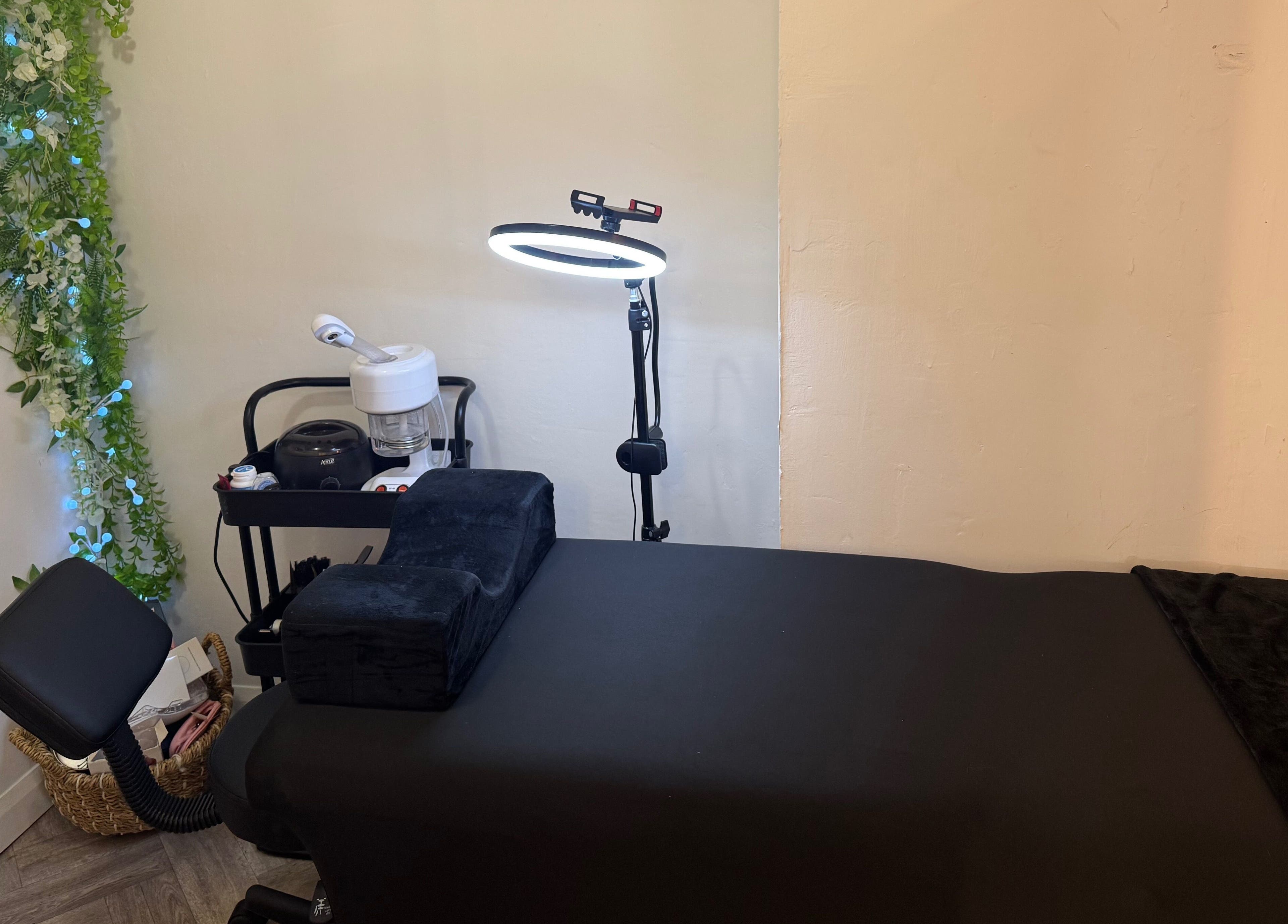 Relaxing treatment room at By Alicia - Hair and Beauty, Ponteland, England, GB with lush greenery decor.