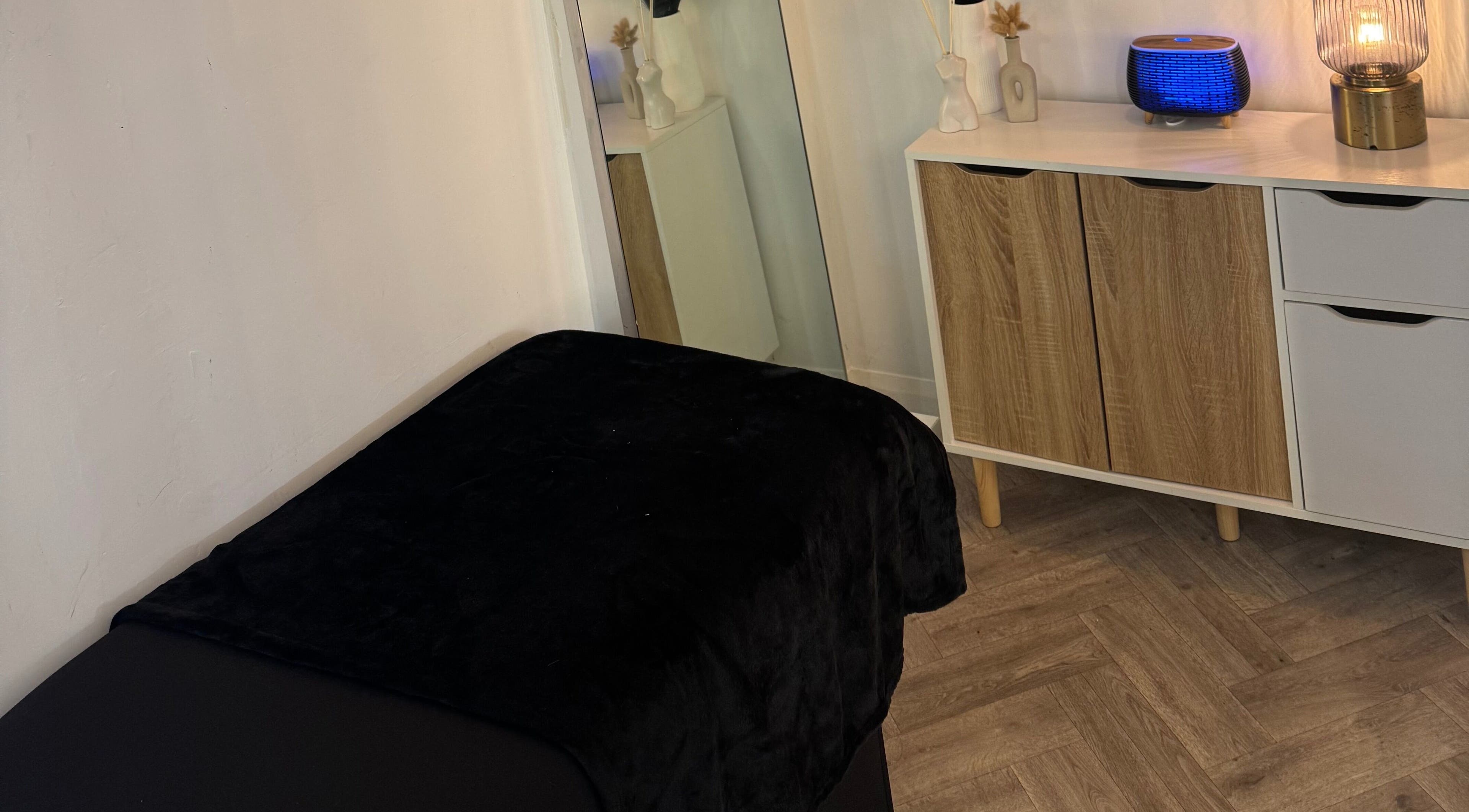 Relaxing spa room at By Alicia - Hair and Beauty, Ponteland, England, GB featuring a cozy massage bed.