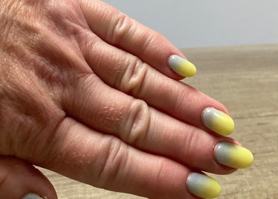 Vibrant ombre yellow nails by Nail tech Norfolk at Wisbech Saint John's Fen End, England, GB.