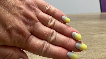 Vibrant ombre yellow nails by Nail tech Norfolk at Wisbech Saint John's Fen End, England, GB.