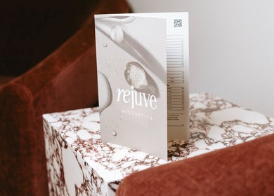 Rejuve Aesthetica brochure on marble table in Sydney, New South Wales, AU.