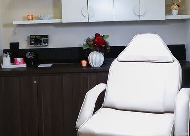 Modern treatment room at Rejuve Aesthetica, Sydney, New South Wales, AU, featuring a sleek white chair.