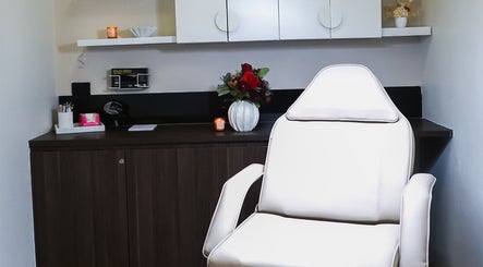 Modern treatment room at Rejuve Aesthetica, Sydney, New South Wales, AU, featuring a sleek white chair.