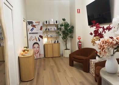 Modern lounge at Rejuve Aesthetica, Sydney, New South Wales, AU with elegant decor and beauty products.