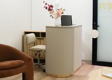 Reception area at Rejuve Aesthetica in Sydney, New South Wales, AU, featuring stylish seating and decor.