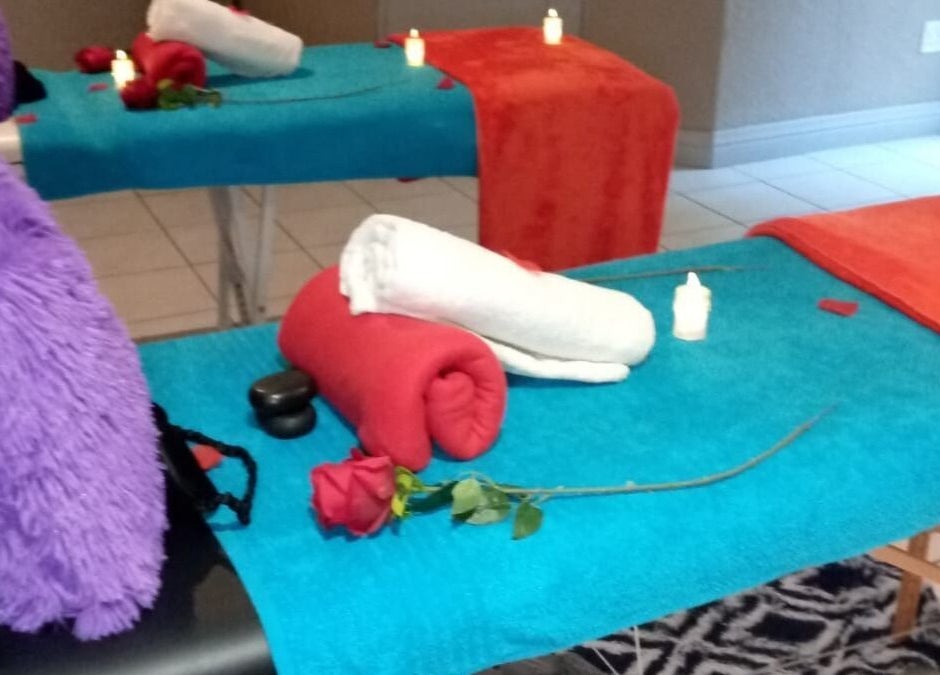 Cozy massage tables with colorful towels at Magical Haven Spa, Johannesburg, Gauteng, ZA.