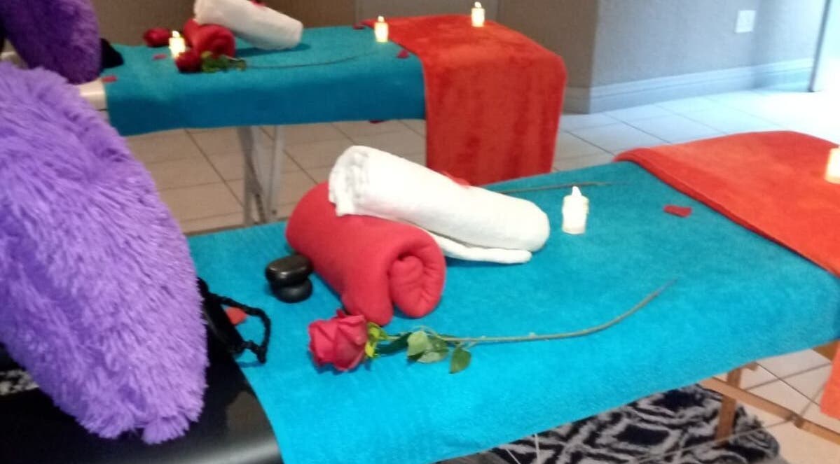 Cozy massage tables with colorful towels at Magical Haven Spa, Johannesburg, Gauteng, ZA.