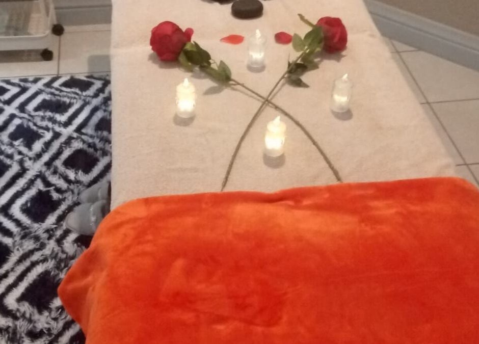Relaxing spa setup with candles and rose petals at Magical Haven Spa, Johannesburg, Gauteng, ZA.