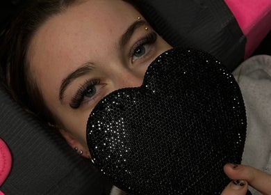 Close-up of eyelashes and a black heart at The Doll Haus, High Wycombe, Western Australia, AU.