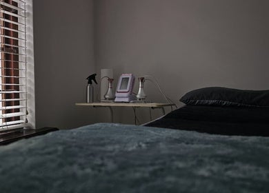 A calming treatment room at The Body Bar in Gqeberha, Eastern Cape, ZA with equipment and soft lighting.