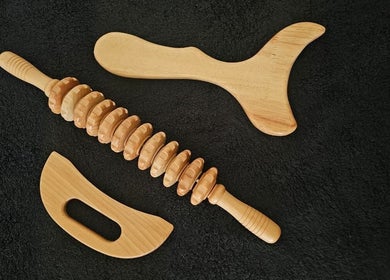 Wooden massage tools at The Body Bar, Gqeberha, Eastern Cape, ZA, ideal for therapeutic relaxation.