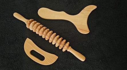 Wooden massage tools at The Body Bar, Gqeberha, Eastern Cape, ZA, ideal for therapeutic relaxation.