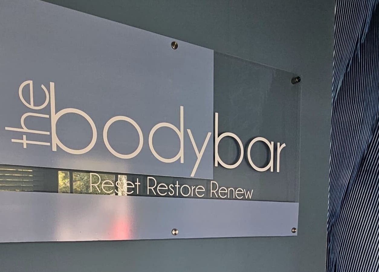 Elegant signage of The Body Bar in Gqeberha, Eastern Cape, ZA featuring the phrase 'Reset Restore Renew'.