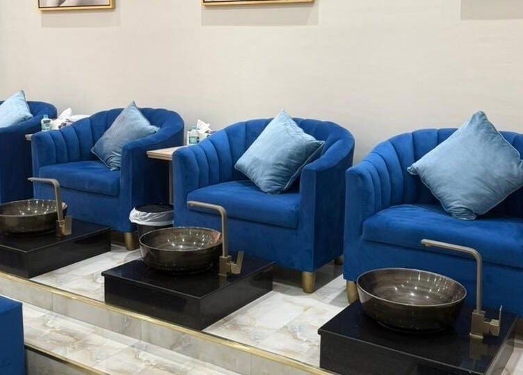 Elegant blue seating at Queens Salon, Ajman, Ajman, AE, offering luxurious pedicure services.