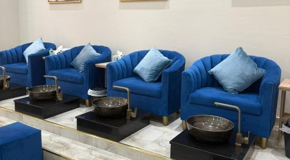 Elegant blue seating at Queens Salon, Ajman, Ajman, AE, offering luxurious pedicure services.