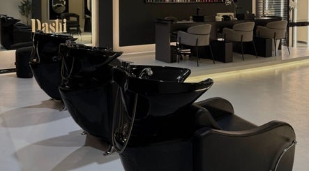 Sleek hair washing stations at DASHI Beauty, Seeb, Muscat Governorate, OM offering relaxing salon experience.