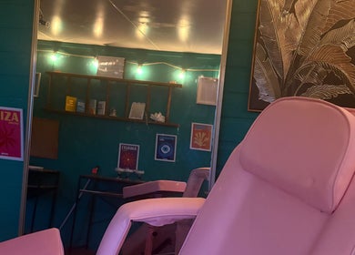 Relax in the stylish lounge of Velvet Tattoos, Dunsdale, England, GB, featuring vibrant decor and comfortable seating.
