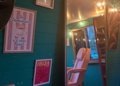 Warm, inviting room at Velvet Tattoos in Dunsdale, England, GB with relaxed seating and artistic decor.