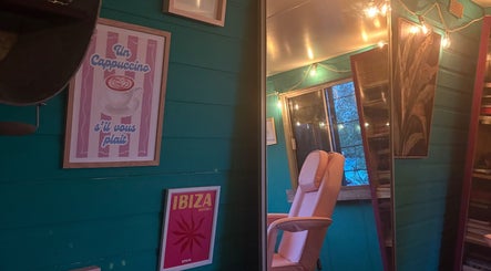 Warm, inviting room at Velvet Tattoos in Dunsdale, England, GB with relaxed seating and artistic decor.