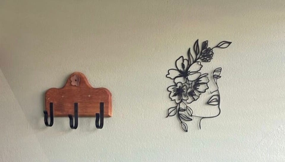 Artistic wall hooks and floral wire art at Tailored Nails & Lashes, Cape Town, Western Cape, ZA.