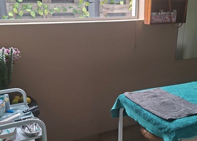 Relaxing treatment room at Tailored Nails & Lashes, Cape Town, Western Cape, ZA with flowers and tools.