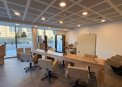 Modern salon interior at Saxons at Tamworth College, Tamworth, England, GB. Features stylish chairs and mirrors.