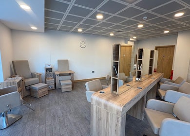 Chic hair and nail salon at Saxons at Tamworth College in Tamworth, England, GB featuring modern chairs and mirrors.