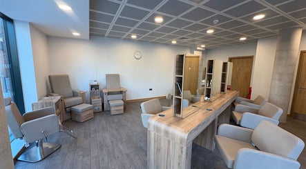 Chic hair and nail salon at Saxons at Tamworth College in Tamworth, England, GB featuring modern chairs and mirrors.