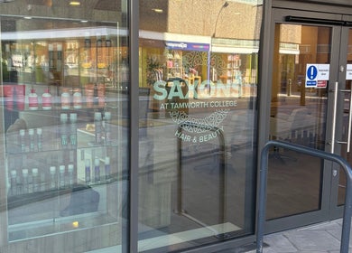 Entrance of Saxons at Tamworth College in Tamworth, England, GB showcasing beauty products in the window display.
