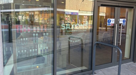 Entrance of Saxons at Tamworth College in Tamworth, England, GB showcasing beauty products in the window display.
