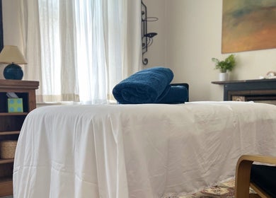 Relaxing therapy room at Her Sanctuary Holistic Therapies, Leeds, England, GB with massage table and decor.