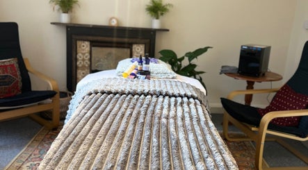Relaxing therapy room at Her Sanctuary Holistic Therapies, Leeds, England, GB, featuring a cozy massage setup.