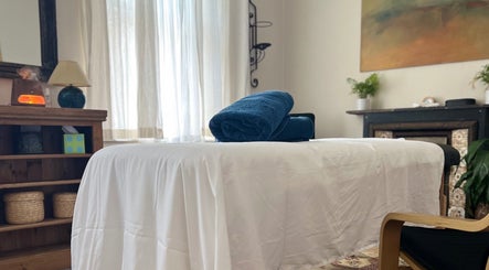 Relaxing massage table at Her Sanctuary Holistic Therapies, Leeds, England, GB, with calming decor.