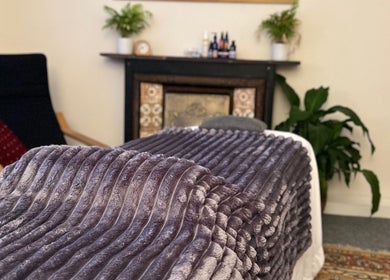 Her Sanctuary Holistic Therapies massage room in Leeds, England, GB features a plush, inviting relaxation space.
