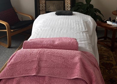 Relaxing massage room at Her Sanctuary Holistic Therapies, Leeds, England, GB with cozy decor.