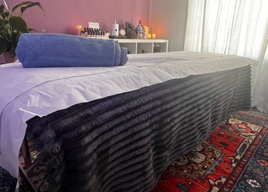 Luxurious treatment bed at Her Sanctuary Holistic Therapies, Leeds, England, GB, enhances relaxation.