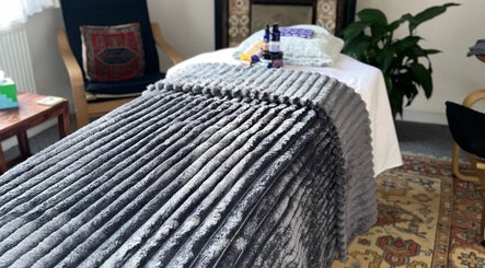 Plush treatment bed at Her Sanctuary Holistic Therapies, Leeds, England, GB offers comfort and relaxation.