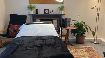 Tranquil therapy room at Her Sanctuary Holistic Therapies, Leeds, England, GB with cozy decor and soft lighting.