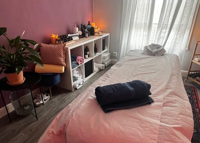 Calming massage room at Her Sanctuary Holistic Therapies, Leeds, England, GB, featuring a cozy table and serene decor.