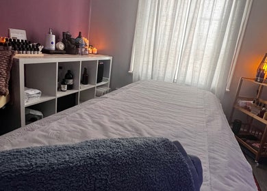 Calming therapy room at Her Sanctuary Holistic Therapies in Leeds, England, GB, with cozy massage table.