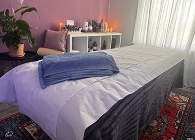 Relaxing therapy room at Her Sanctuary Holistic Therapies, Leeds, England, GB, with a cozy massage table.