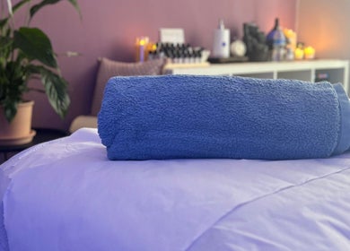 Calming therapy room with blue towel at Her Sanctuary Holistic Therapies in Leeds, England, GB.