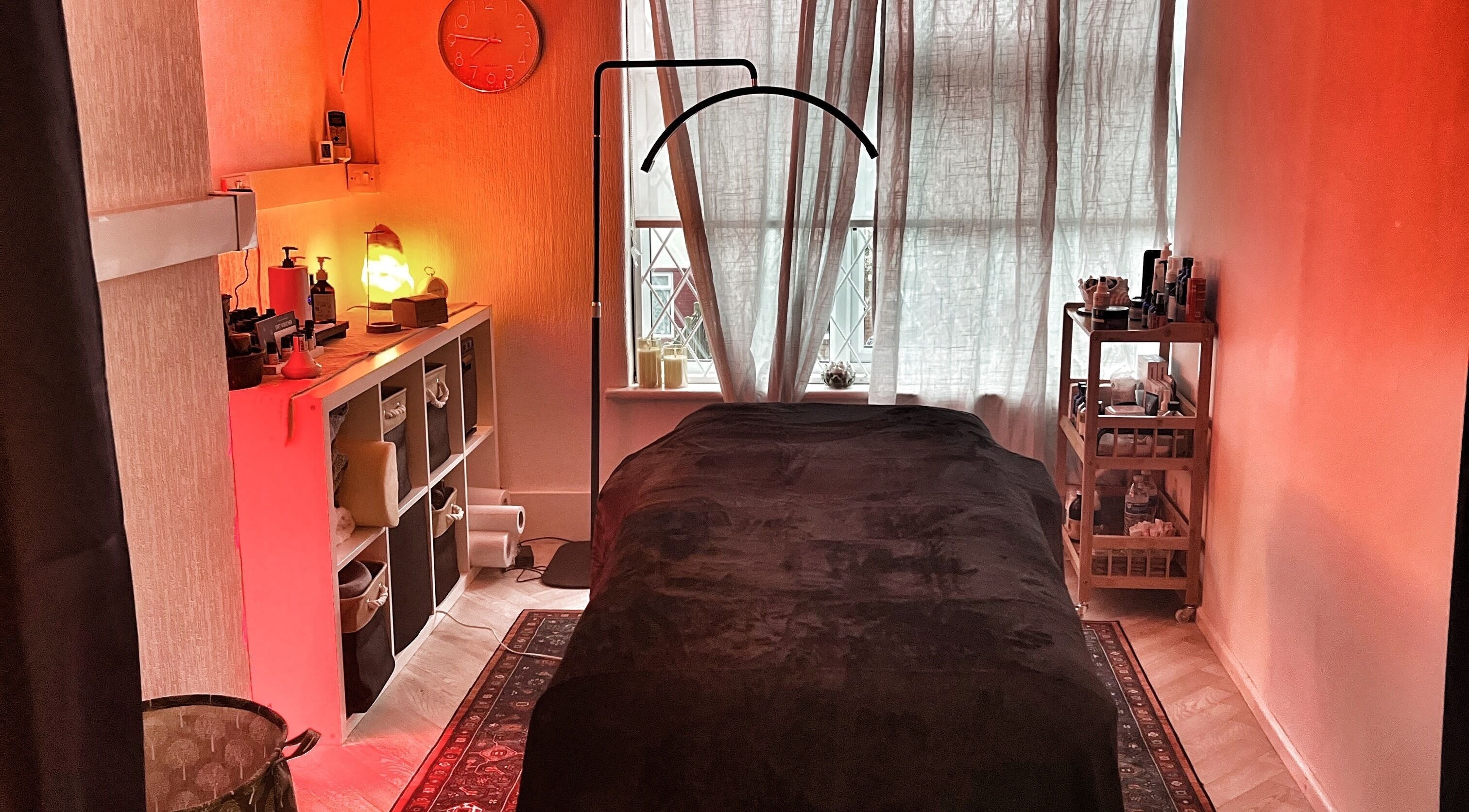 Relaxing therapy room at Her Sanctuary Holistic Therapies in Leeds, England, GB with warm lighting and cozy decor.