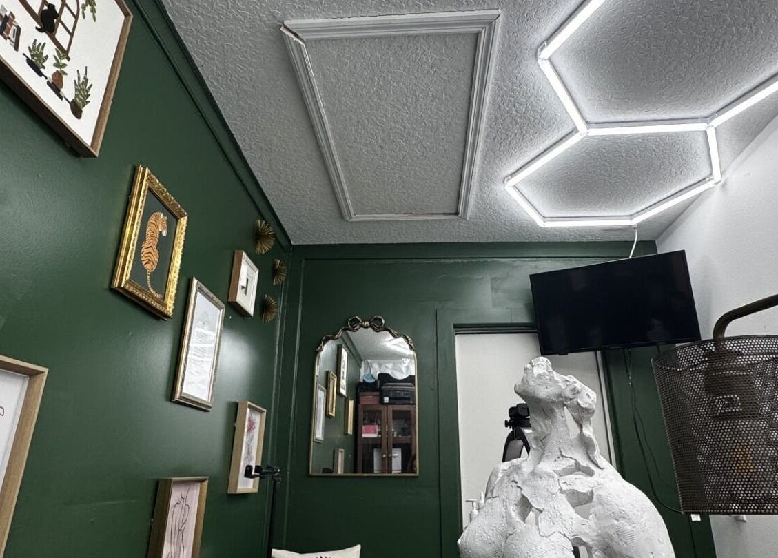 Creative gallery wall and decor at Glam N'Glow by Alisha in Winter Haven, Florida, US.