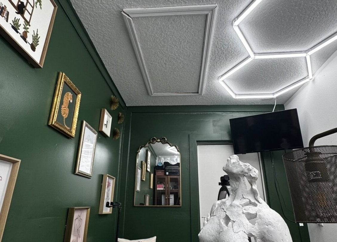 Creative gallery wall and decor at Glam N'Glow by Alisha in Winter Haven, Florida, US.