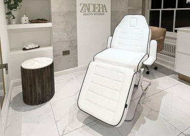 Relaxing spa chair at Brows or Brows, London, England, GB. Clean, white, modern aesthetic for beauty treatments.